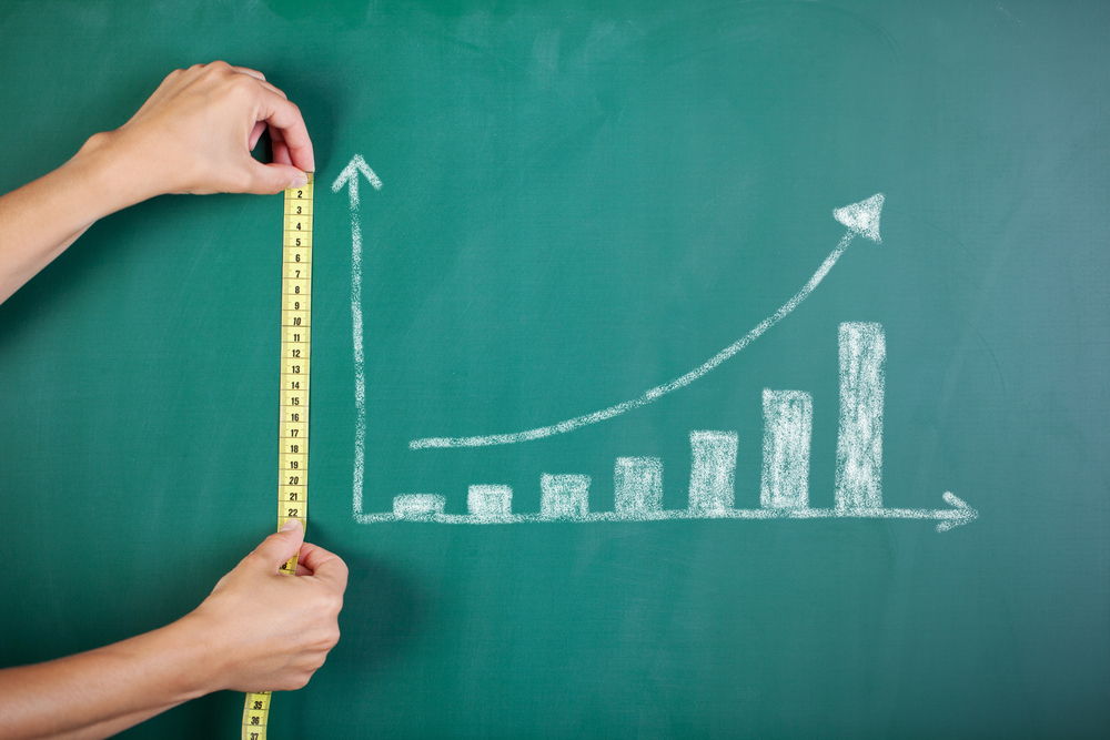 An image of measuring columns on a chalk board